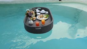 floating breakfast poolside at a tropical luxury villa during vacation - Powered by Shutterstock - Get 15% off with code: PIKWIZARD15