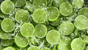 Super Slow Motion Shot of Splashing Fresh Limes. Filmed on High Speed Cinematic Camera at 1000fps. - Powered by Shutterstock - Get 15% off with code: PIKWIZARD15
