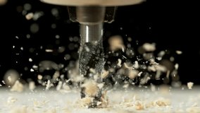 Super slow motion of a drill bit drilling into wood. macro. Filmed on high speed cinema camera, 1000 fps. - Powered by Shutterstock - Get 15% off with code: PIKWIZARD15