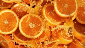 Super Slow Motion Shot of Splashing Fresh Oranges. Filmed on High Speed Cinematic Camera at 1000fps. - Powered by Shutterstock - Get 15% off with code: PIKWIZARD15