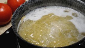 Noodles or pasta being boiled in boiling water, close-up - Powered by Shutterstock - Get 15% off with code: PIKWIZARD15