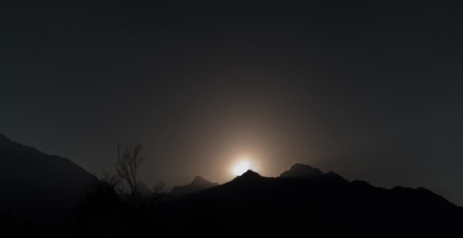 sunrise behing a mountain time lapse in gilgit pakistan