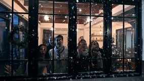 Cute little girl look through the window feel exciting to see snowfall first time of winter season. Adorable child sitting in a beautifully decorated living room in Christmas festival with family. - Powered by Shutterstock - Get 15% off with code: PIKWIZARD15