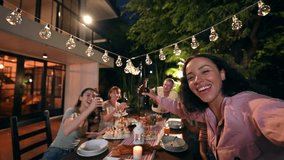 Cheerful black woman taking video call and celebrating outdoors party atmosphere with family at garden within the house. Big family multi-ethnic celebrating outdoors party at garden within the house.  - Powered by Shutterstock - Get 15% off with code: PIKWIZARD15