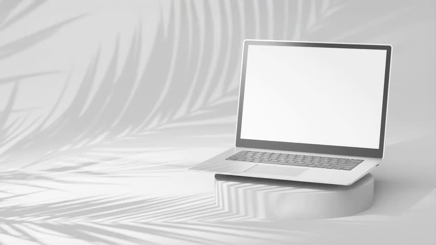 Sleek silver laptop on round pedestal, empty screen with palm tree shadows on off white background