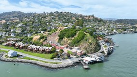 Pan right aerial shot following Tiburon coastline wide view of city