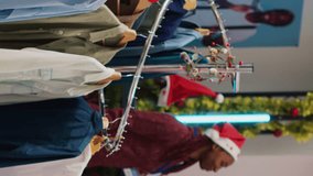 Vertical video Senior woman browsing through blazer racks in clothing shop men section, looking for perfect Christmas gift for son during winter holiday season. Client in fashion boutique checking - Powered by Shutterstock - Get 15% off with code: PIKWIZARD15