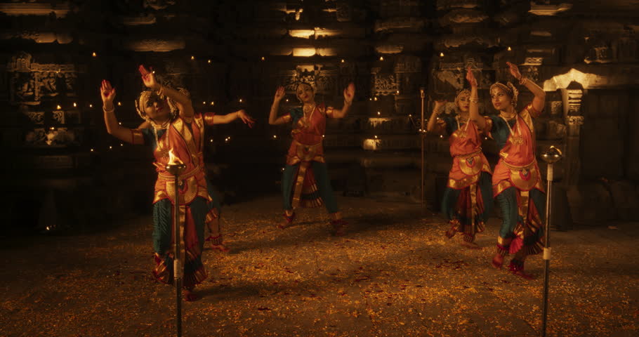 Enchanting Slow-Motion Portrayal Showcases a Lively Ensemble of Indian Women Joyfully Dancing Traditional Folk Inside an Empty Historic Temple. Vibrant and Mesmerizing South Asian Cultural Festivity