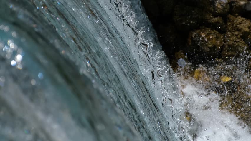 A clear clean water flowing continuously from the waterfall
