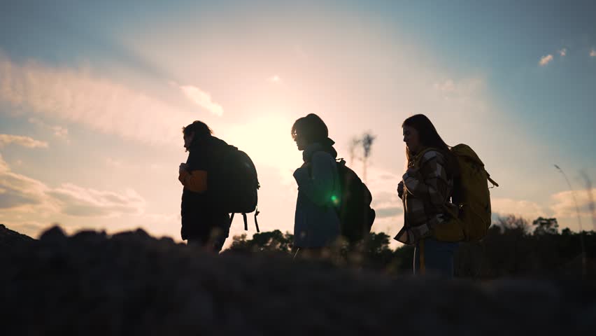 Teamwork. Group of tourists with backpacks hiking in nature in mountains. Trekkers and backpacks at hiking trip in summer. Hiking adventure people travel young group. Active lifestyle travel tourists Royalty-Free Stock Footage #1107285195