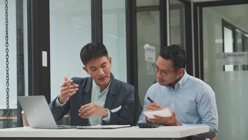 Serious young business asian man supervisor analyse financial report of responsible worker pay attention on mistakes propose correction. insurance agent legal obligations, policy terms conditions Royalty-Free Stock Footage #1107287749