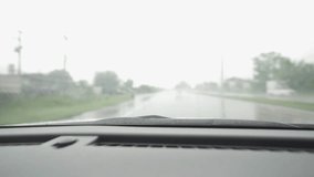 4k video shot from a car driving on a rainy road during the day in Thailand, Chiang Mai
