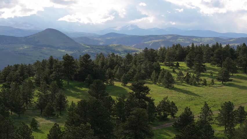Beautiful natural landscape of Colorado. Lush green vegetation, forest and mountain scenery. Aerial panorama