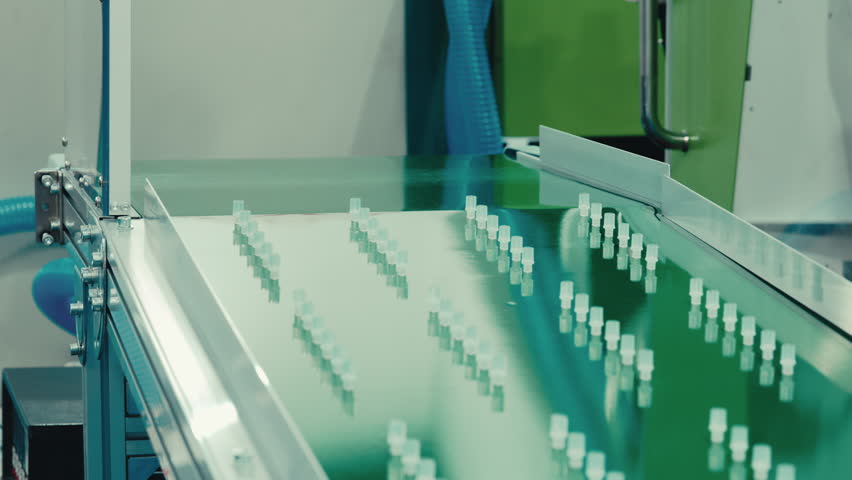 Factory for the Production of Protective Cup of Syringe, Blanks Progress Along Linear Conveyor, Streamlining the Manufacturing Process. Technology, Medical Equipment Concept | Shutterstock HD Video #1107297071