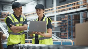 Fulfillment Center: Supervisor and Manager Control Automated Operations in Logistics Warehouse. Using Laptop to Monitor Inventory, Loading of Product Boxes On Conveyor, Customers Order Delivery - Powered by Shutterstock - Get 15% off with code: PIKWIZARD15