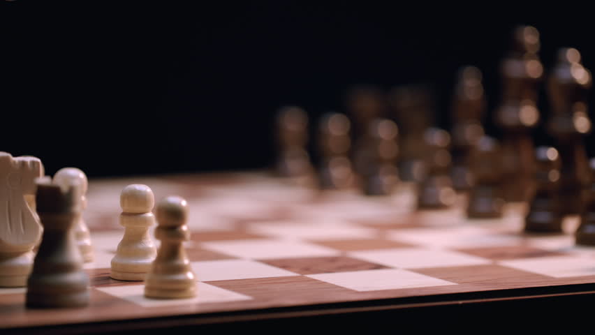 Latino Male and Caucasian Female Chess Players Move Pawn Chess Pieces - Close-up Macro, Rack Focus. Shot at 120 fps with Macro lens and exported at 23.98 fps. Royalty-Free Stock Footage #1107302289