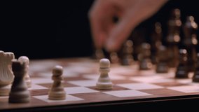 Latino Male and Caucasian Female Chess Players Move Pawn Chess Pieces - Close-up Macro, Rack Focus. Shot at 120 fps with Macro lens and exported at 23.98 fps. - Powered by Shutterstock - Get 15% off with code: PIKWIZARD15