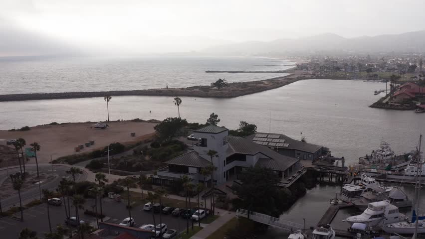 Aerial descending close-up shot of the Channel Islands National Park Visitor Center in Ventura, California. 4K