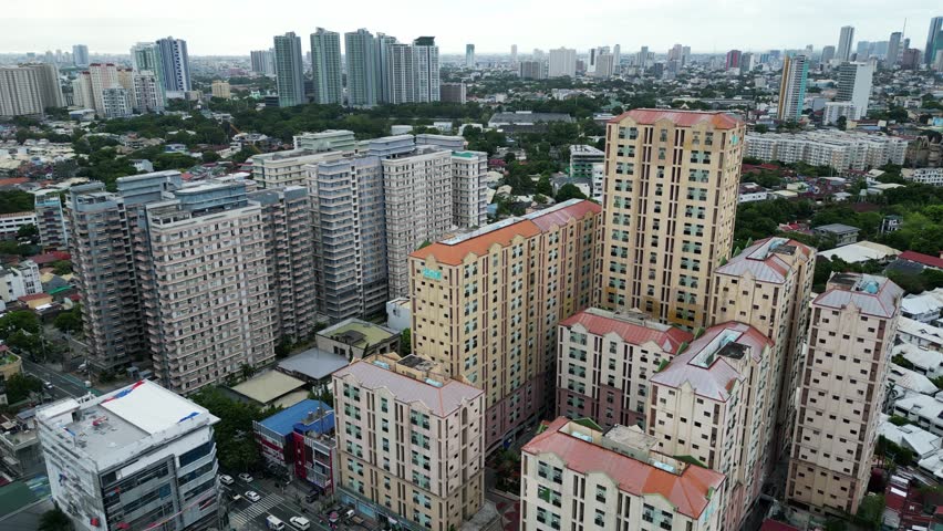 Aerial establishing of Quezon city skyscrapers and apartment buildings
