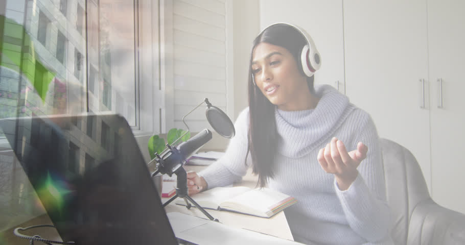 Animation of biracial businesswoman recording podcast over people walking and cityscape. Global business, finances, digital interface, computing and data processing concept digitally generated video. | Shutterstock HD Video #1107318461
