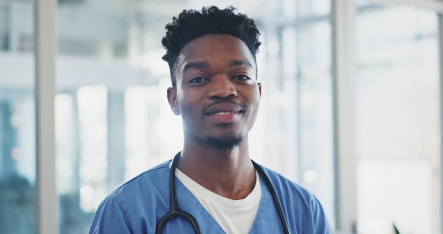 Doctor face, man and happy for healthcare service, hospital or clinic with smile and professional mindset. Young nurse, african student or medical worker in portrait for internship opportunity or ADN Royalty-Free Stock Footage #1107327511