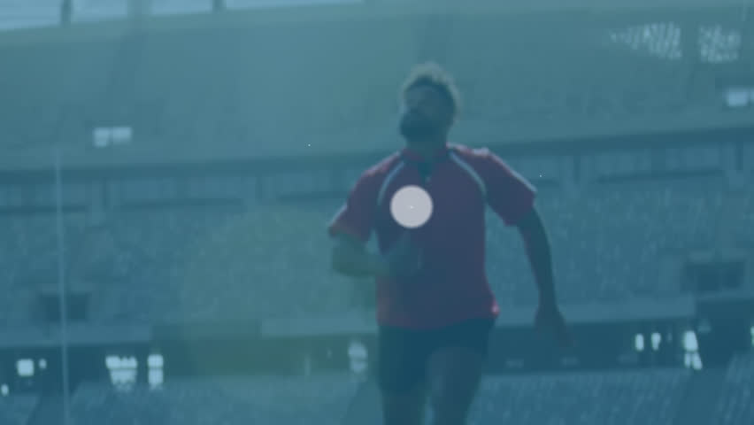Animation of network of digital icons over rugby players throwing the ball up in the sky at stadium. Global networking and sports fitness concept