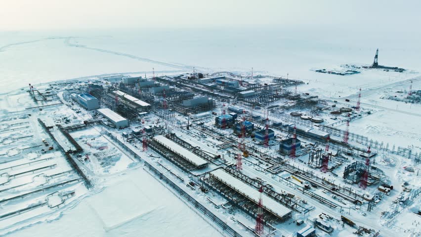 A big city is being built on an ice field. Time lapse. People and cars are moving. Construction works are underway. The North of Russia. A clear winter day. Royalty-Free Stock Footage #1107330365