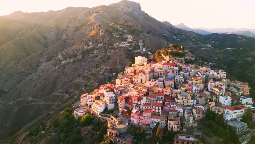 Spectacular Aerial Sunset Views of Taormina and Castelmola Medieval Villages in Sicily | Italy's Charming Historic Landscapes from Above Royalty-Free Stock Footage #1107333561