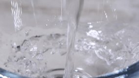 close-up water pouring into glass. 4k video capture