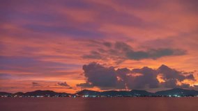 
Time lapse magical scene as the sky transforms into magical hughes as 
the clouds take on dramatic shapes above the peaks.
beautiful pink sky at sunset above the sea in nature and travel concept.