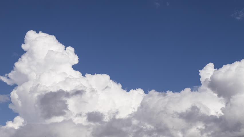 Time-lapse footage of white cumulus clouds in a blue sky. Royalty-Free Stock Footage #1107351863