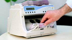Money Counter Machine In Action. Montage Of Three Video Clips Showing Electronic Money Counter Processing Euro 500 bills. European Union Currency. 