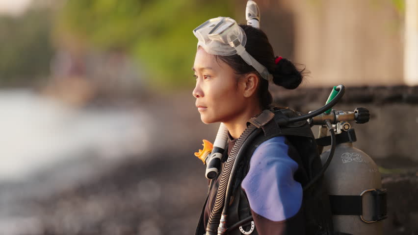 Portrait of scuba diver on beach, diving vacation in exotic location for fun