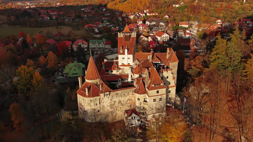 Aerial around view of Bran castle in Transylvania region, Romania. Autumn season and dark clouds, 4k Royalty-Free Stock Footage #1107366693