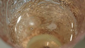 Close-up of champagne bubbles in a glass. Top view of a delicious drink - Powered by Shutterstock - Get 15% off with code: PIKWIZARD15