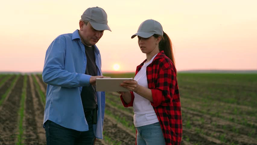 two farmers work field handshakemachinery road insurance wealth digital horizon slow pc cereal view garden labor sky worker inspect, corporate sunset, work tablet agriculture, hand sun farming farm Royalty-Free Stock Footage #1107372953