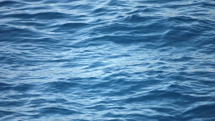Sea water concept: Aerial video shot of the blue sea ocean water as seen from a boat sailing at 30 knots speed