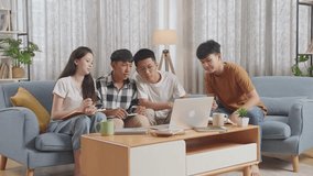 Asian Teen Group Studying Online At Home. Having Video Conference On Laptop, Smiling, Waving Hands
