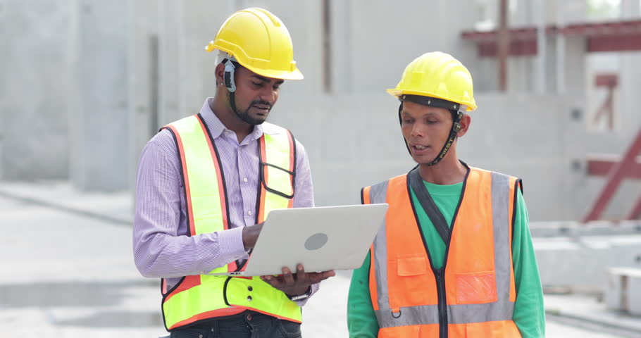 Asian indian construction architect Engineering man and senior worker in safety hardhat working on laptop computer at Prefabricated concrete factory Heavy industrial Royalty-Free Stock Footage #1107374699