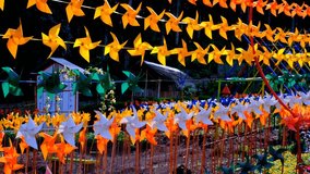 Travel and Vacation Footage. Landscape video of rows of bright and colorful spinning pinwheels. The pinwheel that adorns the tourist park. High Quality 4k Videos