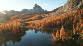 Drone flyght over Federa Lake in sunrise time. Autumn mountains landscape with Lago di Federa and bright orange larches in the Dolomite Apls, Cortina D'Ampezzo, South Tyrol, Dolomites, Italy - Powered by Shutterstock - Get 15% off with code: PIKWIZARD15