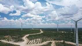 Wind turbines - clean energy, aerial view - drone video, open space, summer sunny day with beautiful clouds, Spain.
