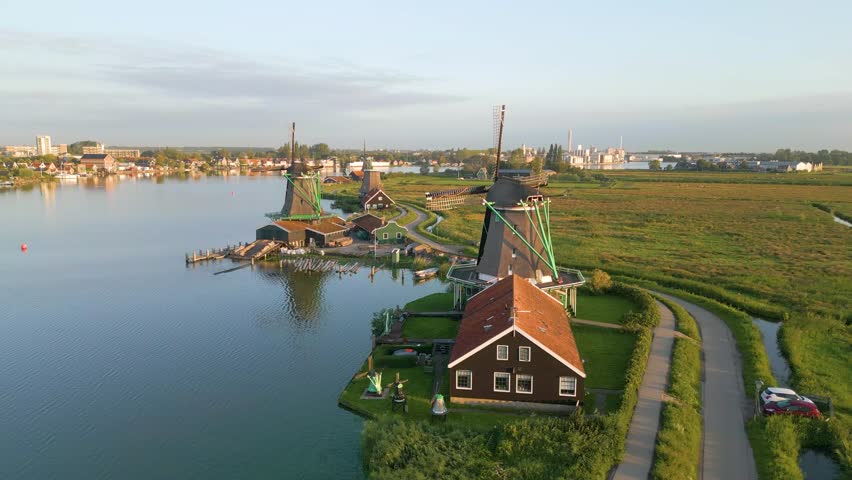 This is an aerial drone shot of The Zaanse Schans. a dutch tourist park where you can see typical old dutch houses and the famous windmills. these pictures were taken at sunrise. Royalty-Free Stock Footage #1107402331