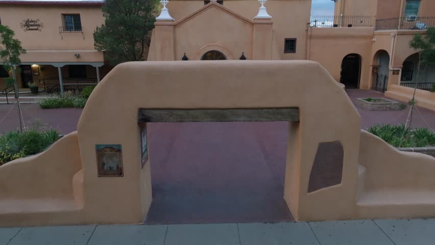San Felipe de Neri Catholic Church in Old Town Albuquerque, New Mexico. Aerial rising shot of historic plaza building.