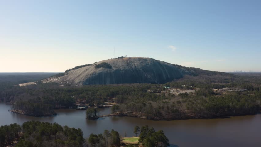 Aerial drone shot slowly rotating clockwise around the NE side of Stone Mountain near Atlanta, Georgia.