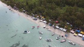 Drone footage tropical beach boats scenic seaside beach island