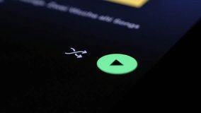 Play and shuffle button of Spotify app, close up view