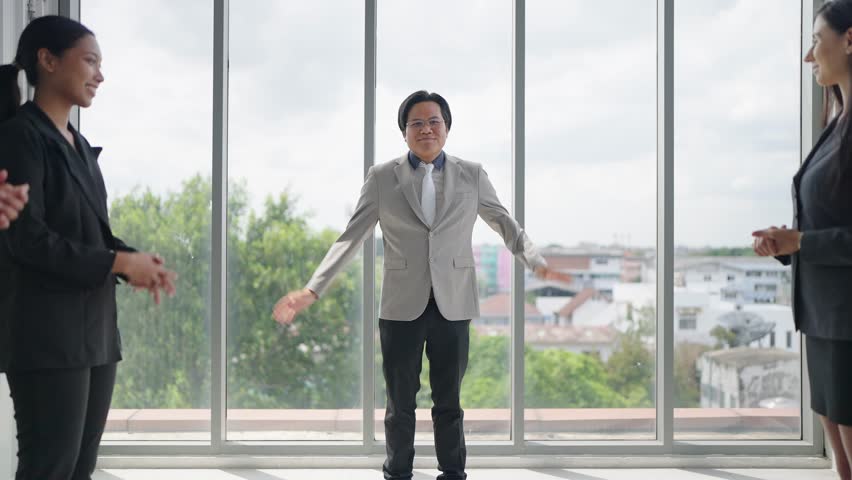 Asian man leader dancing successful company business achievement. Happy business people clapping hands for congratulating success business. Business success concept | Shutterstock HD Video #1107432503