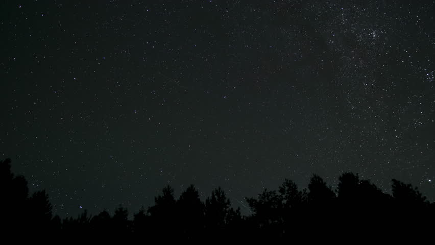 Timelapse of moving stars in night sky. Stars move around a polar star. 4K