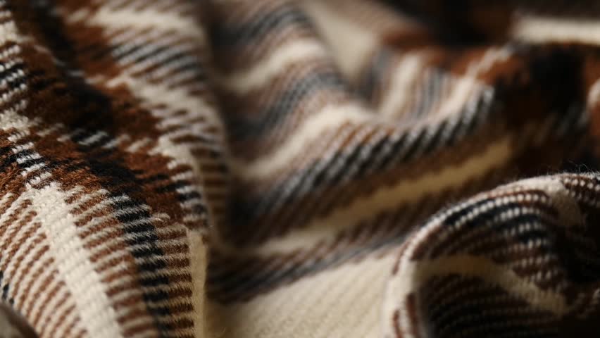 Soft checkered woolen cloth, fashion industry, cozy blanket in warm tones
 Royalty-Free Stock Footage #1107439097